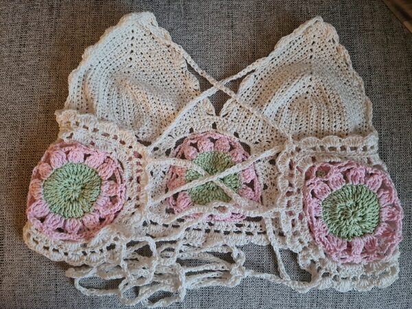 Bakc of Cream, pink and green crochet halter top with granny squares. Triggerfish Crochet