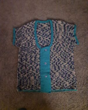 Blue green half sleeved crochet front open sweater with turquoise trimming by Triggerfish Crochet.