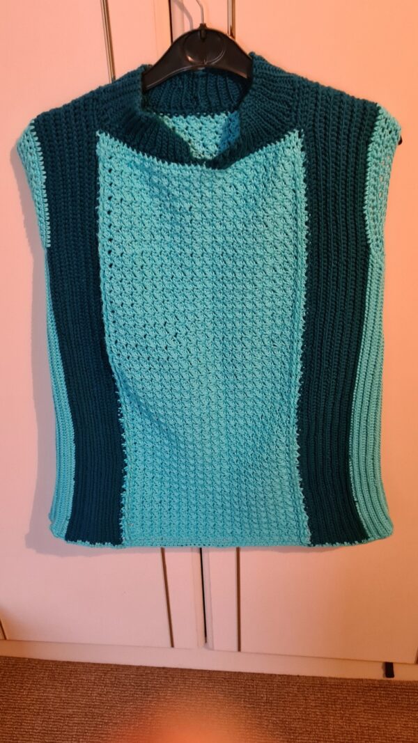 Turquoise crochet shirt using cotton yarn with indigo blue stripes on the sides by Triggerfish Crochet