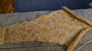 Pink yellow and blue coloured yarn used to create panels for an elf coat. Triggerfish Crochet
